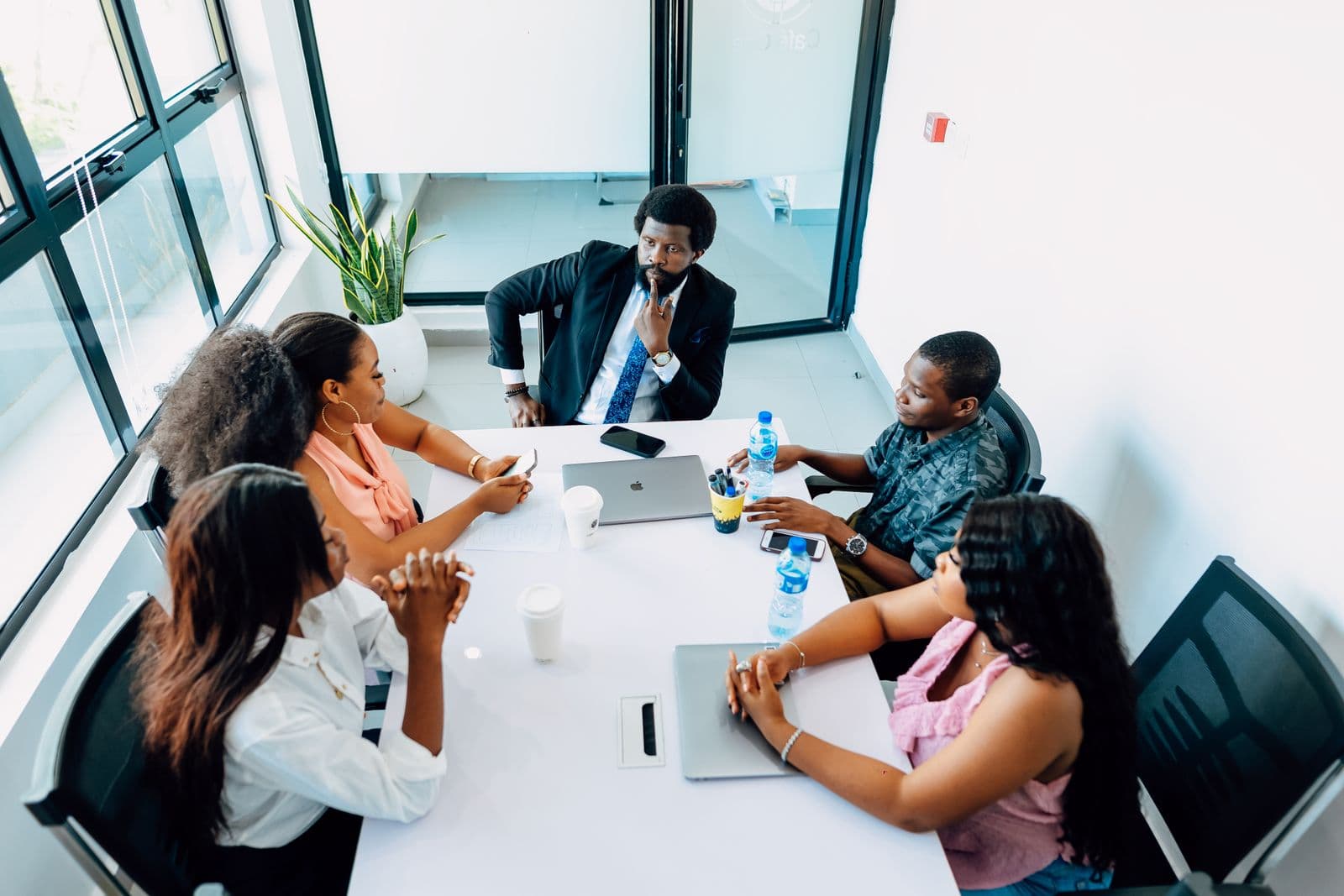 A project coordination meeting — one accountable team across the group's divisions.